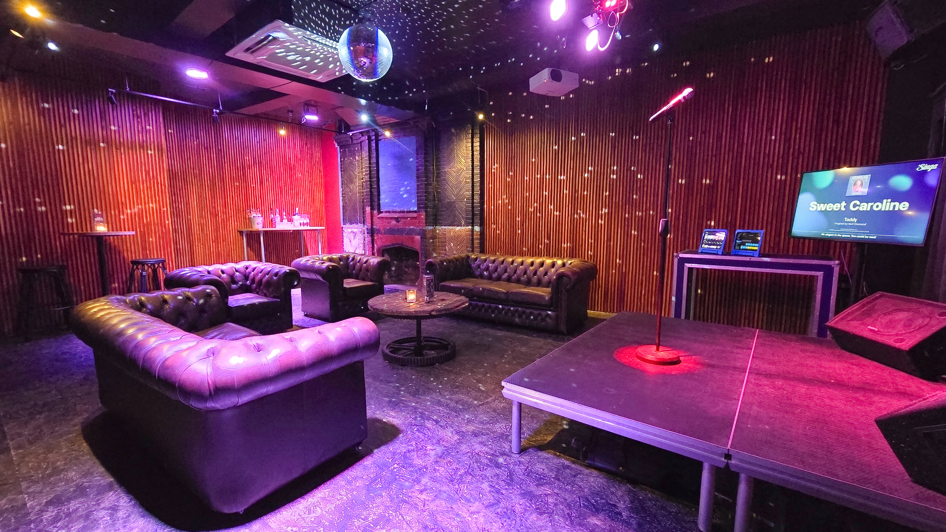 Star-lit karaoke room with disco lights and stage
