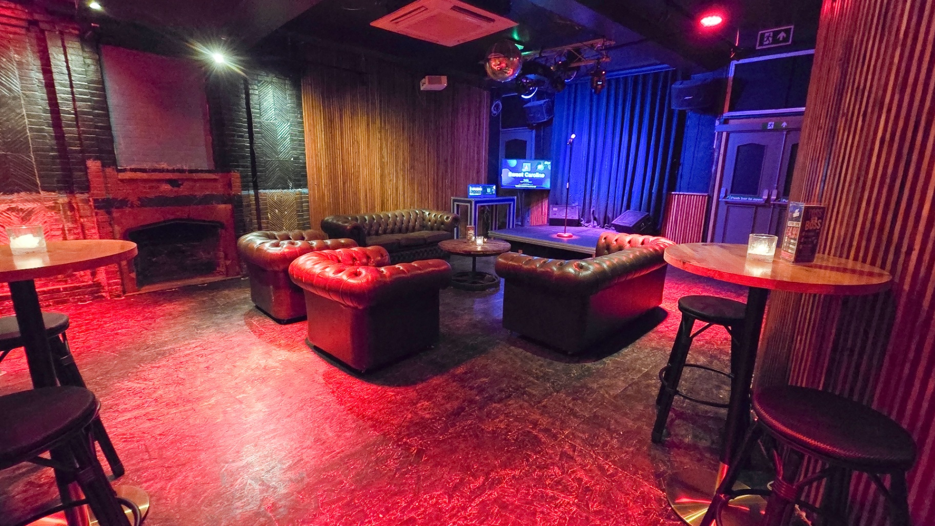 Wide view of the karaoke lounge and stage