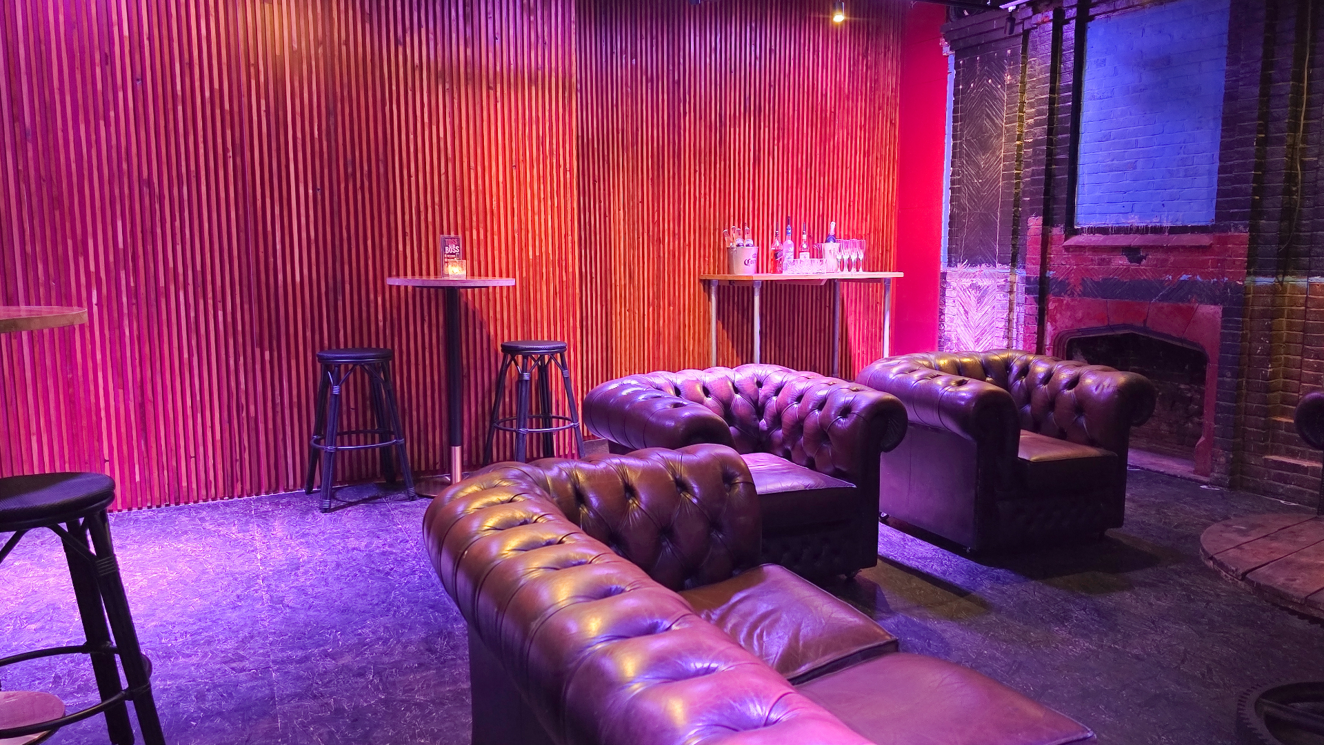 Lounge seating with bottle service table and stools