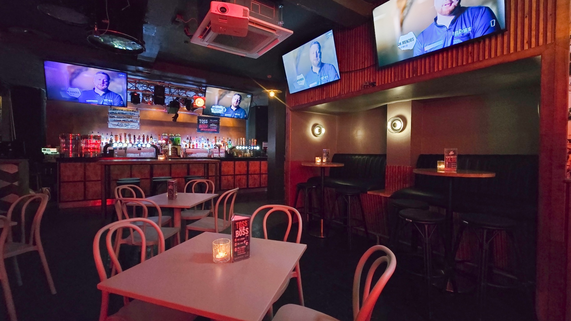 Tables and chairs in front of the bar