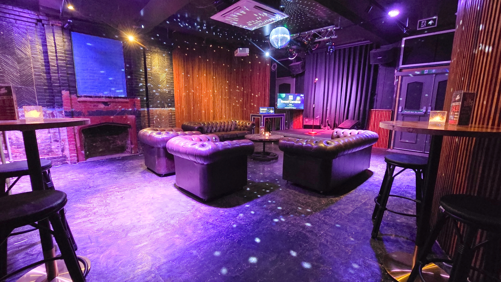 Wide view of the karaoke room from the entrance
