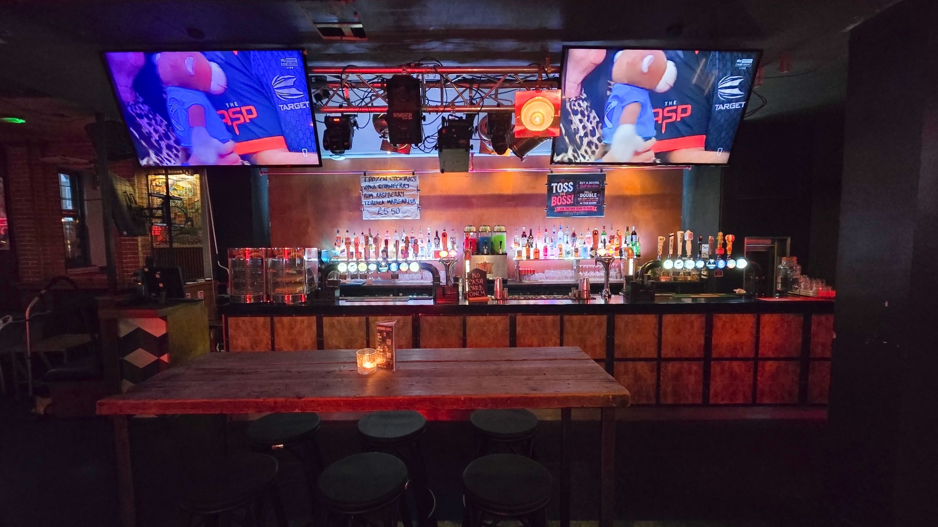 Wide view of the bar and darts screens